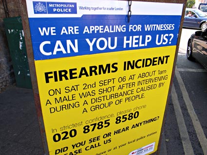 Yellow police incident boards, gun shootings on Coldharbour Lane, Brixton, Lambeth, London SW9, 2006