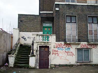 Graffiti and faded elegance, Brixton Road, Brixton, Lambeth, London, England SW9