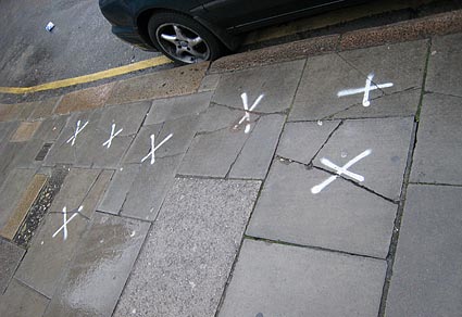 Crosses on the pavement, Brixton photos, snapshots on the streets of Brixton, Lambeth, London SW9 and SW2