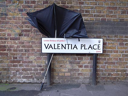 Broken umbrella and road sign, Valentia Place.. Brixton photos, snapshots on the streets of Brixton, Lambeth, London SW9 and SW2