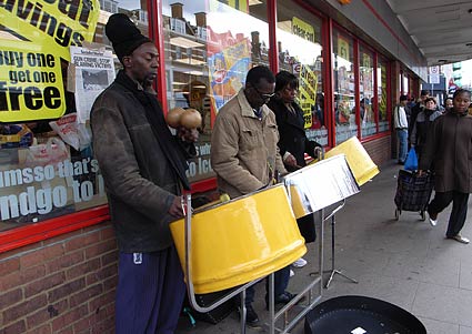 Steel drummers busking outside Iceland, by Brixton tube station, Brixton Road, London, February 2007