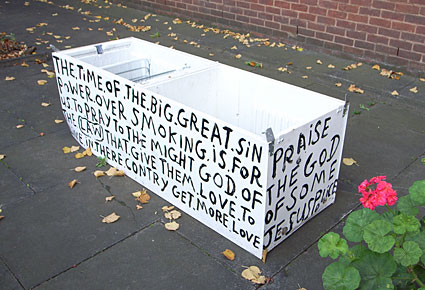Religious slogans on plant pots outside Brixton Police Station, Gresham Road,  Brixton, Lambeth, London SW9