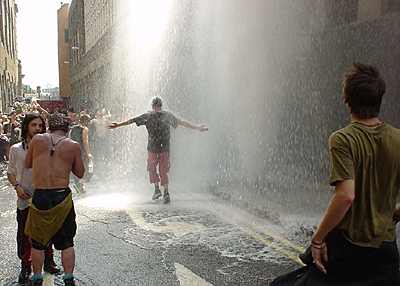 protesters cool down under a 'liberated' hydrant