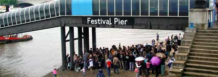Reclaim the Beach partygoers under the Festival Pier, Thames, London