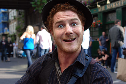 A particularly enthusiastic busker by Borough Market, London, July 2007