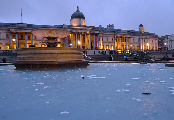 London snow scenes - frozen fountains in Trafalgar Square and snow on Coldharbour Lane, Brixton, January 2010