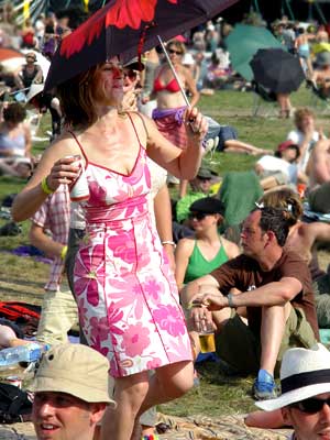 Dancing with an umbrella, Big Chill festival, Eastnor Castle 2004, England UK