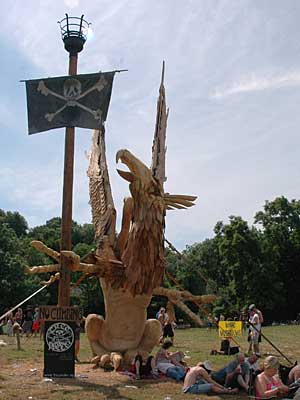 Wood sculpture by the stone circle, Glastonbury Festival, Pilton, Somerset, England June 2005
