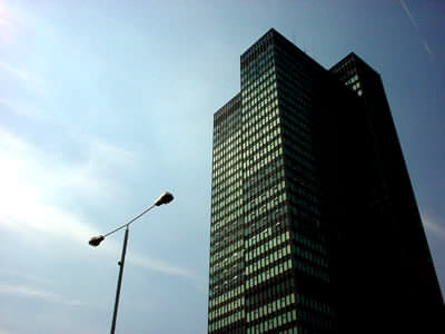 sky, skyscraper and street lamp