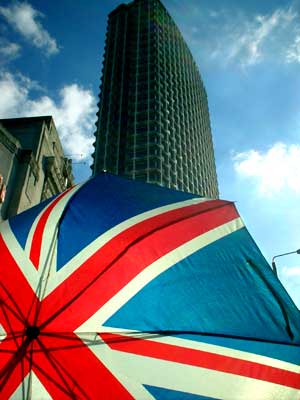 Union Jack umbrella and Centrepoint, London: October 2002