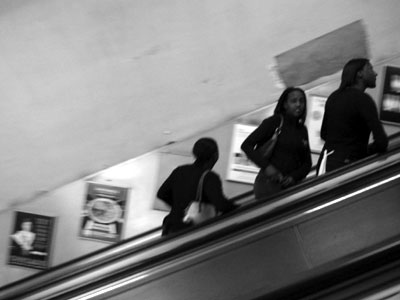 Up escalator, Tottenham Court Road tube station, London W1