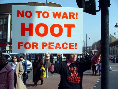 Protester holding anti-war placard, Brixton anti-war protest , Brixton, London March 20th 2003