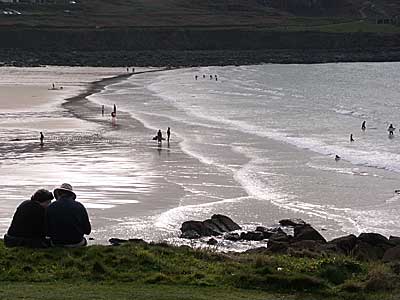 Surfers and couple, Porthmeor Beach, St Ives, Cornwall, April 2004