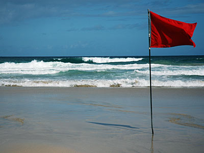 Red flag on Porthmeor beach, early morning in St Ives, St Ives, Cornwall, August 2005