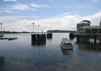 Pleasure boat sets off from Mermaid Quay, Cardiff Bay, Cardiff, south Wales
