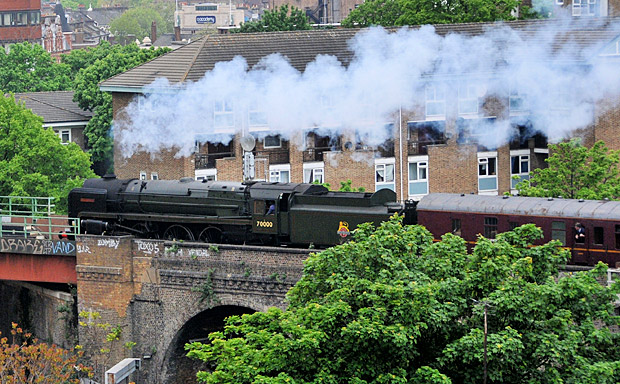 Britannia 7000 loco steams past Brixton